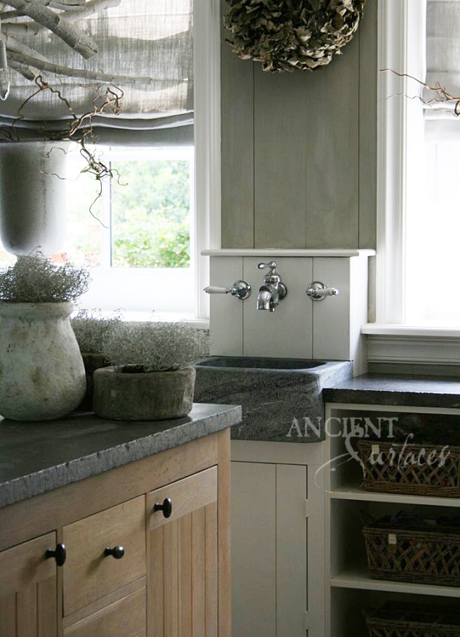A Small Hand Carved Mounted Basalt Vegetable Sink.