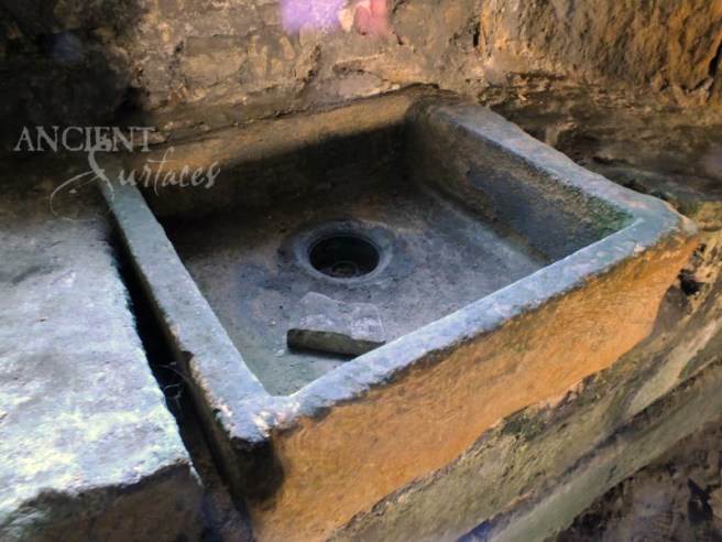 A real old limestone sink. Self supporting and hand carved out of a full block of stone.
