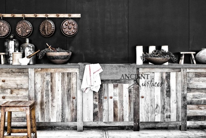 Hand Carved Basalt Sink Installed with Reclaimed Wood Cabinets and Antique Stone Floors.